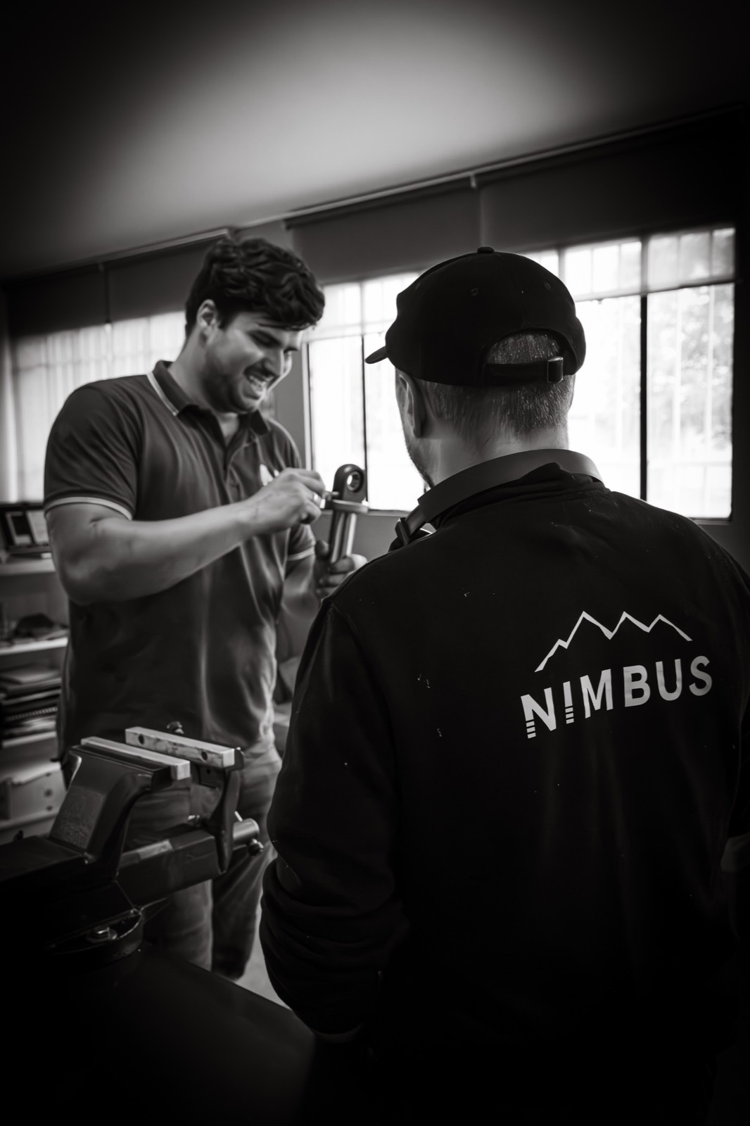 A Nimbus advisor walking a customer through a suspension unit in the workshop